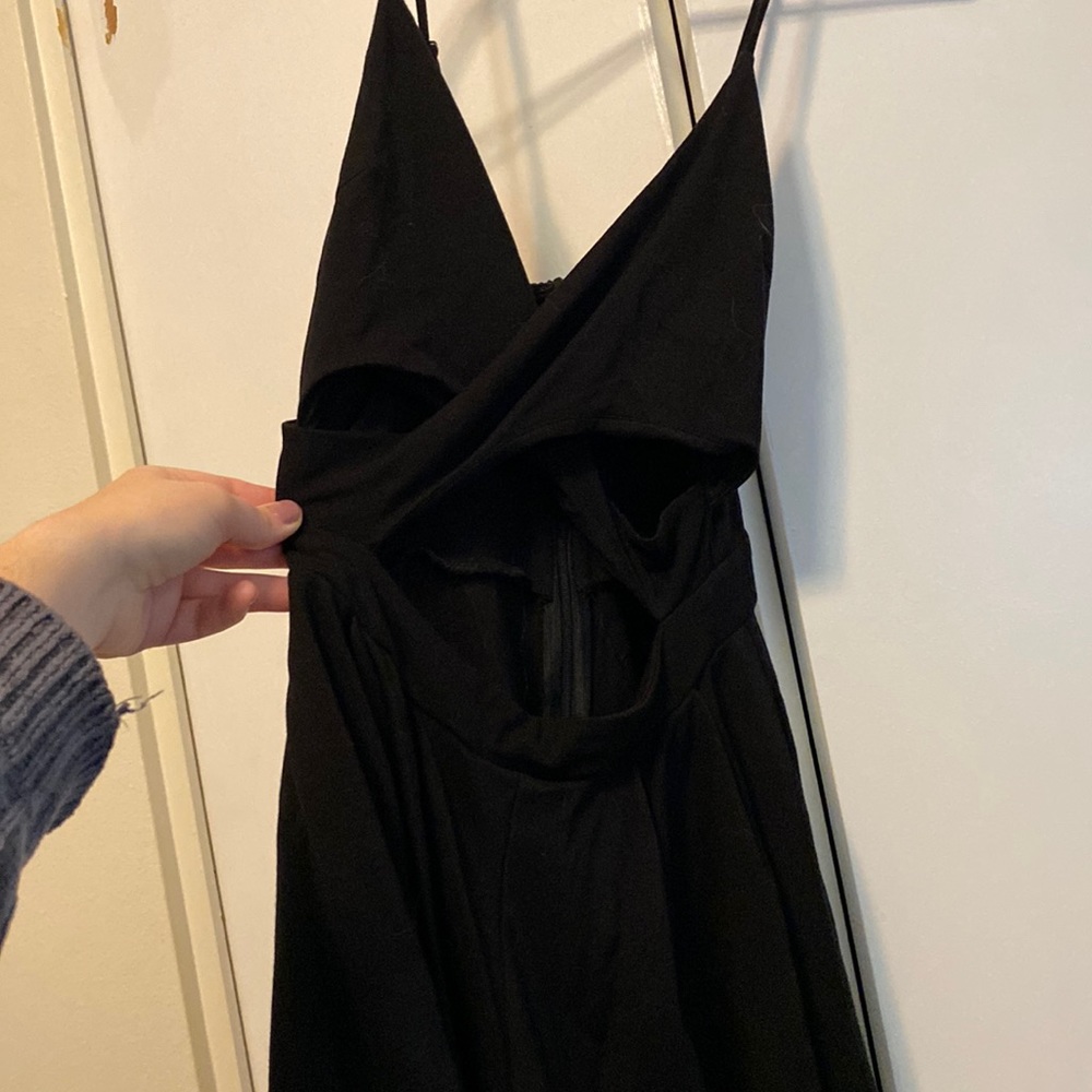 Boutique black romper with front cut out. Adorable and flattering fit.